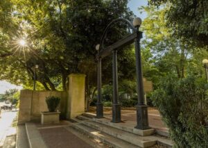 The Arch with early morning sunlight filtering through the trees.