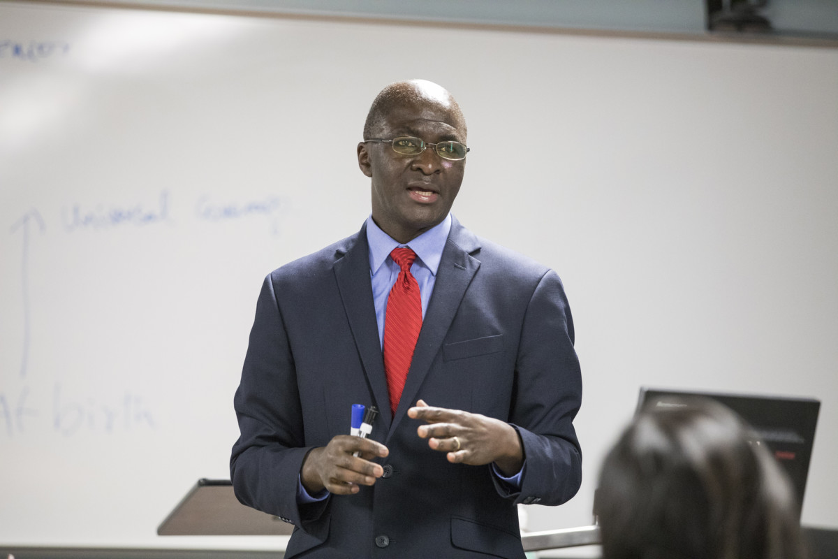 Professor David Okech teaches a class at the School of Social Work.