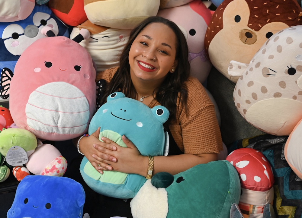 BSW Student Jalynn Colvin surrounded by Squishmallows. (Photo by Wingate Downs)