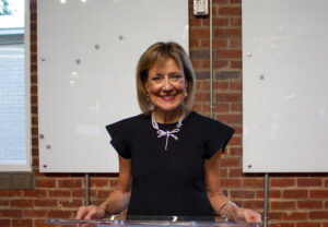 Pamela Landwirth standing at podium